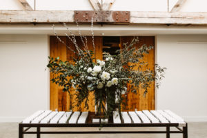 Roundhouse wedding flowers escort card table floral arrangement